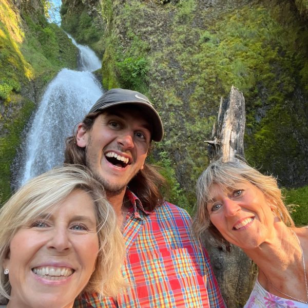 a man and a woman smiling for the camera