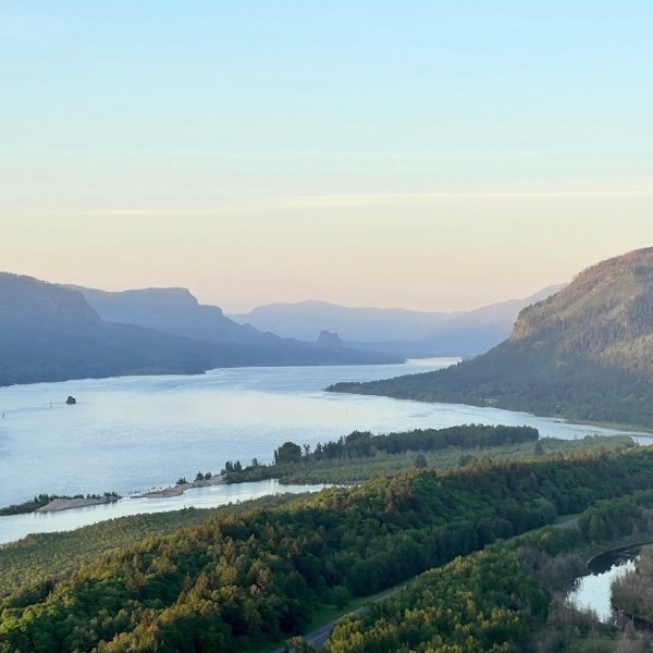a body of water with a mountain in the background