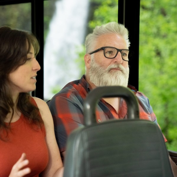 a man and a woman in glasses looking at the camera