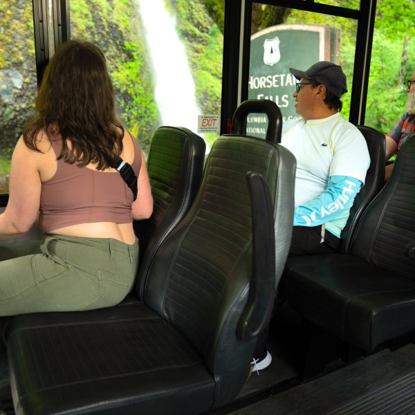 a group of people sitting on a bus