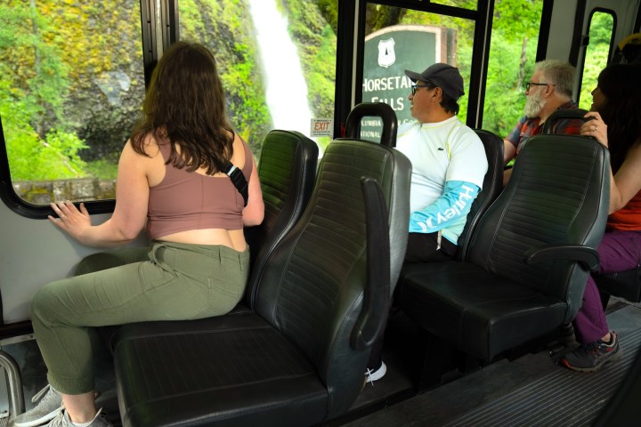 a group of people sitting on a bus