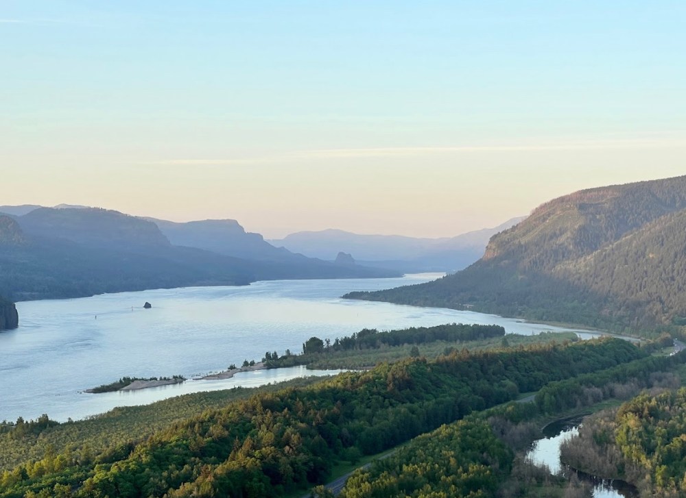 a body of water with a mountain in the background