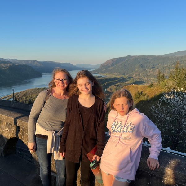 a person standing in front of a mountain