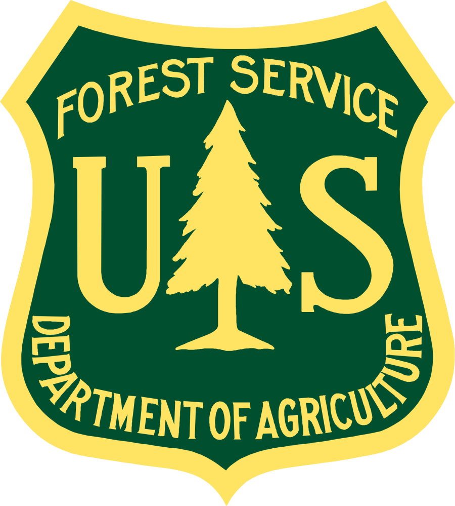 US Forest Service emblem with tree and text in yellow on green background.