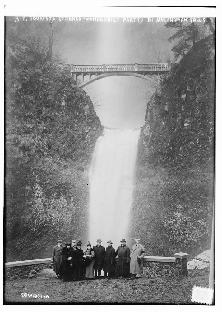 a group of people on a bridge