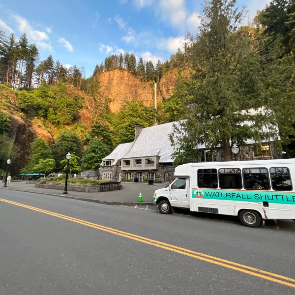 Waterfall Shuttle wedding guest shuttle parked in front of Multnomah Falls Lodge